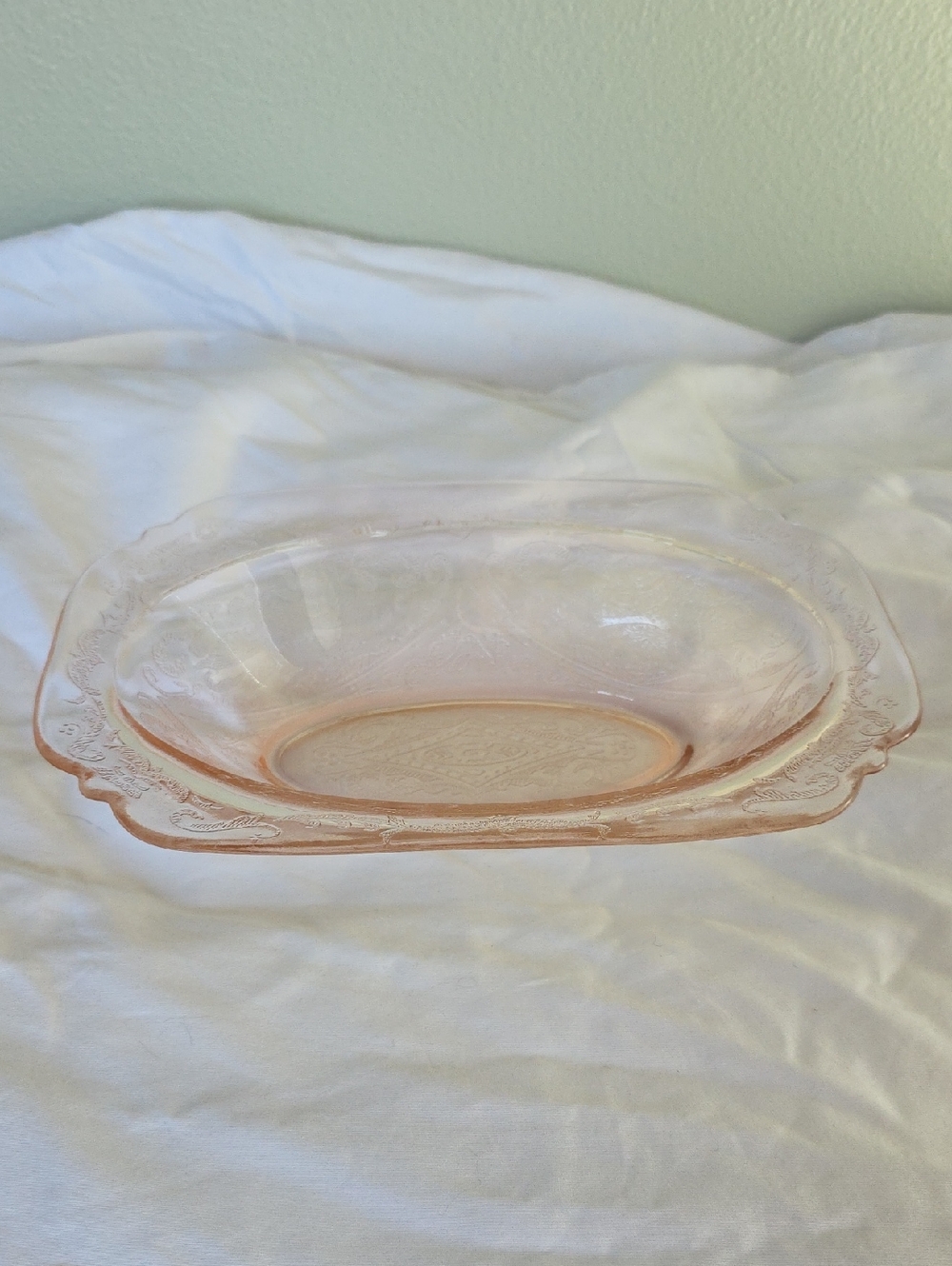 Vintage Pink Depression glass serving bowl with embossed floral pattern.